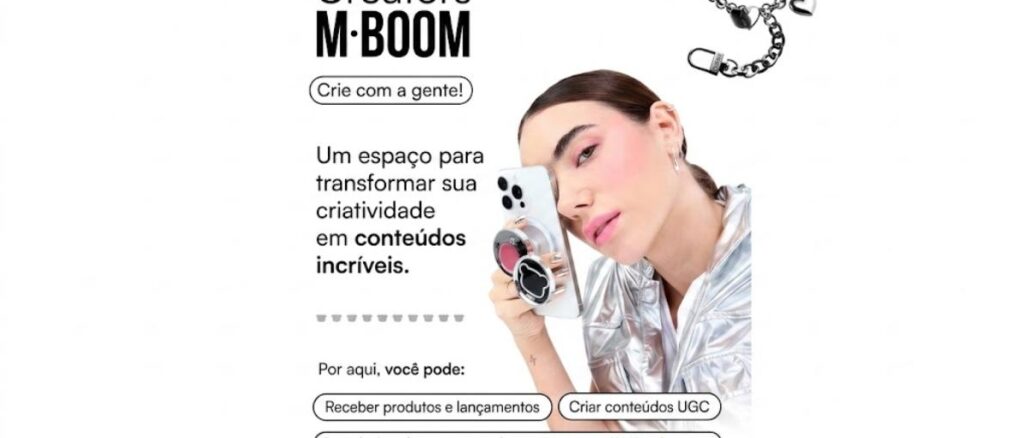 Arte do programa Creators M·BOOM com jovem segurando celular e pulseira de corrente prateada, convidando criadores de conteúdo a participar.
