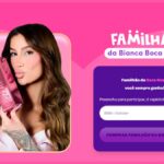 Página de cadastro da promoção Familhão da Bianca Boca Rosa, com a influenciadora segurando uma embalagem rosa metálica escrita R$1 Milhão, sobre fundo rosa vibrante.