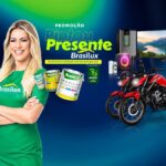 Banner da Promoção Pintou Presente Brasilux, comemorativa aos 33 anos da marca, com prêmios como motos, TV 50 polegadas, caixa de som e geladeira.