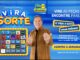 Banner publicitário da promoção Vira Sorte da Tele Sena Semanal no SBT, com apresentador, grade de peças numeradas e prêmio de até R$50.000,00 em certificado de barra de ouro.