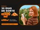 Arte da Promoção 30 Dias de Sorte do Banco Inter com prêmios de R$500mil e R$100mil em barras de ouro e uma jovem ruiva sorrindo com o celular na mão.