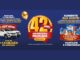 Banner da promoção Aniversário Premiado Rede Krill 42 anos, com dois carros Fiat Mobi brancos, produtos da marca Krill, balões dourados e o período da campanha de 01/10/2026 a 31/10/2026.