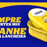 Banner da promoção Compre e Ganhe Dia das Crianças 2026 da Vigor com a frase "Compre 4 iogurtes Mix, ganhe uma lancheira" ao lado de uma lancheira amarela com estampa dos Minions e logotipo Vigor na tampa.