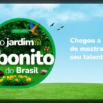 Banner do concurso O Jardim Mais Bonito do Brasil da Trapp, com logotipo circular verde coberto de folhagens, arara, flores amarelas e ferramentas de jardinagem sobre um gramado e céu azul, ao lado da frase Chegou a hora de mostrar o seu talento.