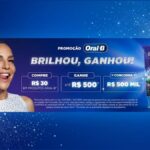 Banner da promoção Oral-B Brilhou, Ganhou com mulher sorridente à esquerda, informações de compra de R$30 em produtos Oral-B, prêmio de até R$500 e chance de concorrer a R$500 mil, e creme dental 3D White com escova de dentes à direita, sobre fundo azul com brilhos.