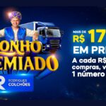 Banner da promoção Sonho Premiado da Rodrigues Colchões com homem fantasiado de gênio ao lado de um carro prata e um caminhão baú azul, anunciando mais de R$175 mil em prêmios.