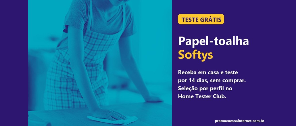 Teste Grátis Softys Mulher de avental xadrez limpando uma mesa de cozinha com papel-toalha, ao lado de um painel roxo com o texto "Teste grátis, Papel-toalha Softys, receba em casa e teste por 14 dias, sem comprar".