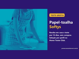 Mulher de avental xadrez limpando uma mesa de cozinha com papel-toalha, ao lado de um painel roxo com o texto "Teste grátis, Papel-toalha Softys, receba em casa e teste por 14 dias, sem comprar".