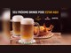 Dois canecos de chope gelado com colarinho cremoso sobre porta-copos, ao lado de uma travessa de camarões empanados com batata palha, sob o texto "Seu próximo brinde pode estar aqui" e os logotipos Camarada Camarão, Heineken e Amstel.