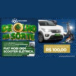 Arte da campanha De Olho na Sorte, da Rede Nova Max, com o logotipo em letras verdes e douradas, um Fiat Mobi branco, uma scooter elétrica e a chamada para vales-compras de R$100,00.