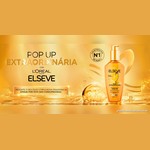 Banner dourado da Pop Up Extraordinária com L'Oréal Paris Elseve, com o frasco do Óleo Extraordinário 100 ml e o selo "Óleo de tratamento nº 1 do mundo".