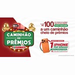 Arte da Promoção de Aniversário Eskynão 2026 com letreiro Caminhão de Prêmios, caminhão vermelho, balões dourados e um iPhone 17 Pro Max laranja sorteado por semana a cada R$100 em compras