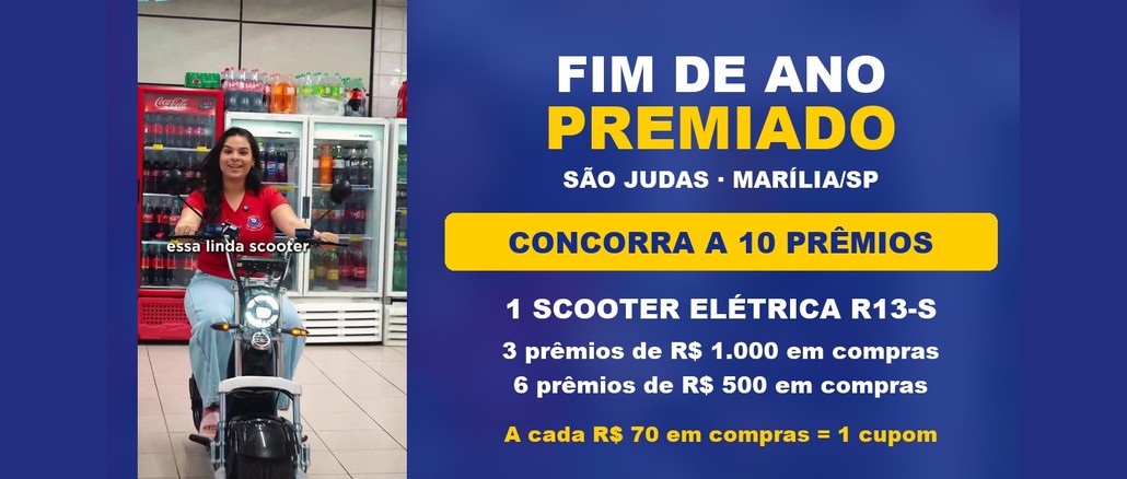 Fim de Ano Premiado São Judas Arte da promoção Fim de Ano Premiado São Judas com mulher de camiseta vermelha sobre uma scooter elétrica em corredor de supermercado e a chamada para concorrer a 10 prêmios, entre eles uma scooter elétrica e vales de R$500,00 e R$1.000,00 em compras.