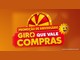 Logotipo da promoção de aniversário Giro que Vale Compras, da Rede Sol Supermercados, com roleta dourada e vermelha, faixa vermelha com o nome da campanha em amarelo e branco e o sol sorridente da marca, sobre fundo laranja.