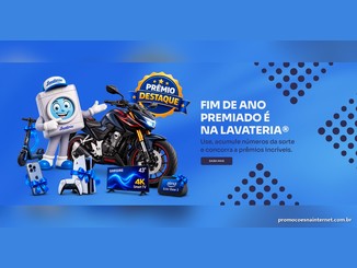 Mascote da Lavateria em forma de máquina de lavar com boné, ao lado de uma moto Honda CB300F, scooter elétrica, iPhone, PlayStation 5, Smart TV Samsung 4K e Echo Show 5, com o texto Fim de Ano Premiado é na Lavateria e o selo Prêmio Destaque