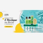 Banner do Compre e Ganhe do Goiânia Shopping com produtos L'Occitane au Brésil da linha Capim-Limão: sabonete líquido, loção corporal, creme para as mãos e sabonete em barra sobre base verde