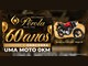 Arte da Promoção Pérola 60 Anos com o logo dourado da Óptica e Relojoaria Pérola, a chamada Compre e Concorra uma Moto 0km e a foto de uma moto Honda vermelha e preta, com a data do sorteio em 11/01/2027 em Birigui-SP.