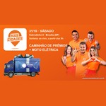 Arte laranja do evento Record nas Cidades em Sobradinho II, com o logo Nas Cidades, um caminhão de prêmios azul com laço e cinco apresentadores da Record Brasília, com a data 31/10 e a chamada Caminhão de Prêmios + Moto Elétrica.